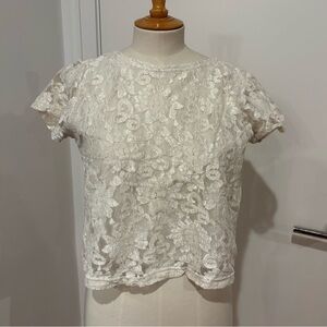 Lacy white vintage top. Fits medium/large.
